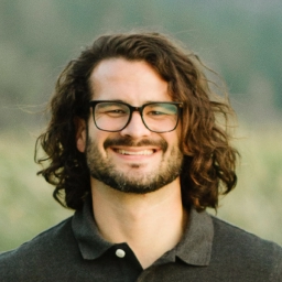 A headshot of Conor Muirhead smiling